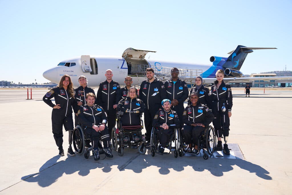 The flight’s passengers, from left to right, back row, Mary Cooper, Cheri Wells-Jensen, Eric Shear, 